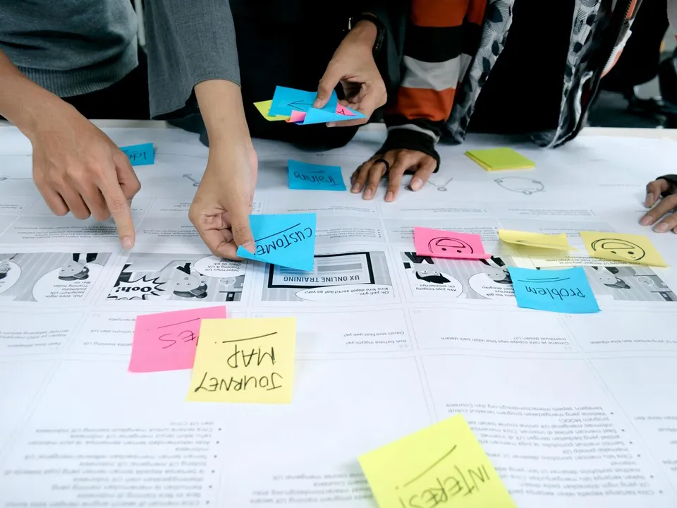 team collaborating with sticky notes